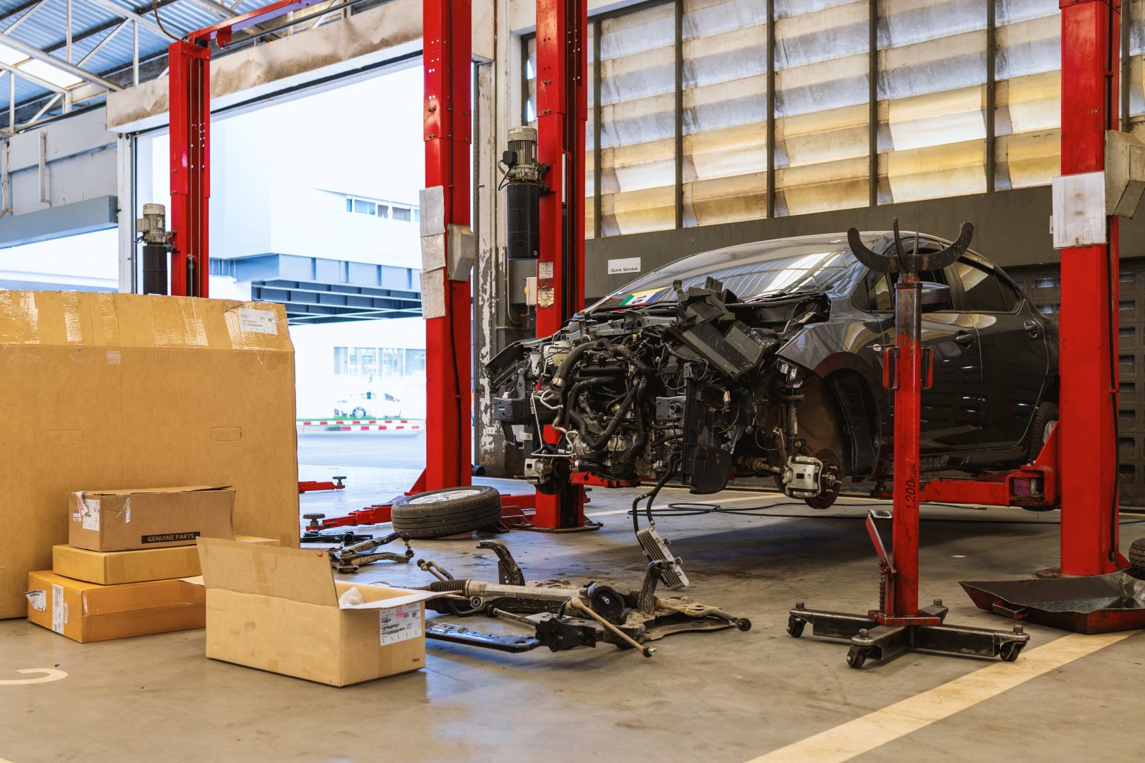 Car,In,Automobile,Repair,Service,Center,With,Soft-focus,And,Over
